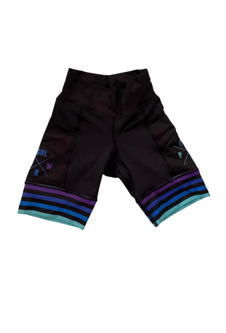 A pair of 8.5 inch women's run hipsters with a GRL PWR logo, featuring side pockets and a wide waistband with colorful striped detailing on the legs.
